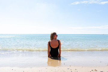 Fototapeta premium Beautiful young woman on the beach