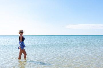 Beautiful young woman on the beach