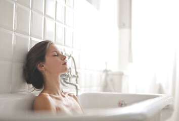 beautiful relaxed woman in bathtub