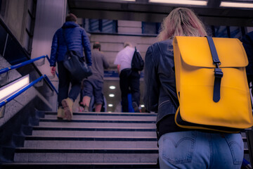 Commuters walking up stairs from the London Underground 