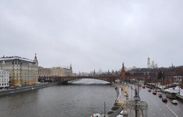 Scenic view from the floating bridge in Zaryadye park to the Bolshoi Moskvoretsky bridge and the Kremlin in Moscow
