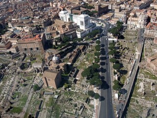 Fototapeta na wymiar Aerial view of the urban city landscape in Rome Italy, above the Monument to Vittorio Emanuele at Piazza Venezia