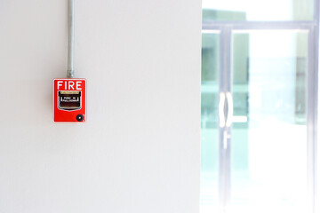 Fire alarm on the white wall.