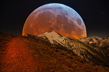 Huge moon guiding the way on midnight hike