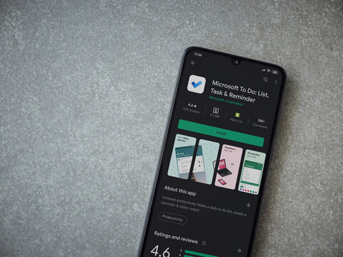 Lod, Israel - July 8, 2020: Microsoft To Do app play store page on the display of a black mobile smartphone on ceramic stone background. Top view flat lay with copy space.