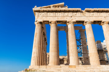 The Parthenon temple in the Acropolis of Athens against the blue sky, Greece.