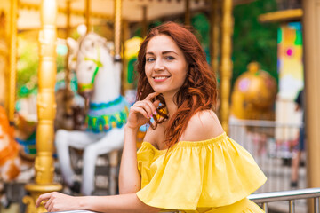 Obraz premium Happy beautiful redhead girl walking in the park