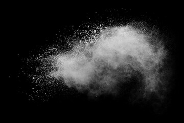 Freeze motion of white color powder exploding on dark background. 