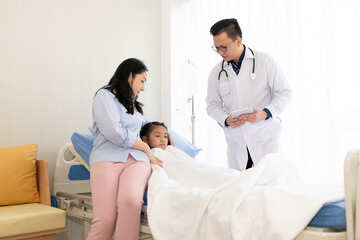 asian mother and doctor talking to child patient in hospital room