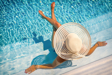 woman in luxury spa resort near the swimming pool. - 377355947