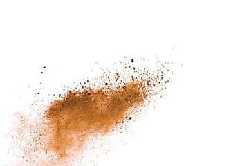 Fototapeta na wymiar Freeze motion of brown color powder exploding on white background. 