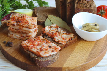 Delicious chopped bacon with spices lies on the table