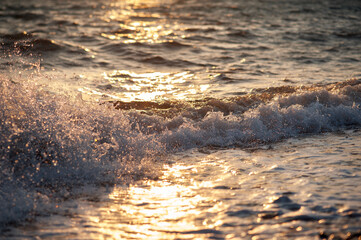 Splashing water in the rays of the setting sun.