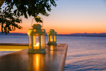 Beautiful white lanterns in the summer against a sunset sky as a background
