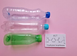 Structural chemical formula of polyethylene terephthalate molecule with plastic bottles made from...