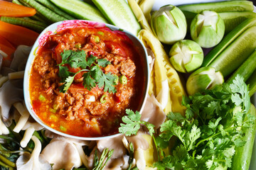 Spicy Northern Thai Pork and Tomato with boiled vegetables and fresh vegetables, for ready to eating.