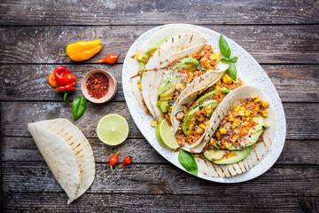 Mexican tacos with meat, beans corn and salsa. Top view
