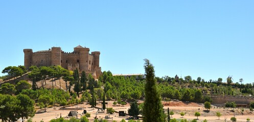 Castle of Belmonte with siege weapons outside and windmill photographed from the town.