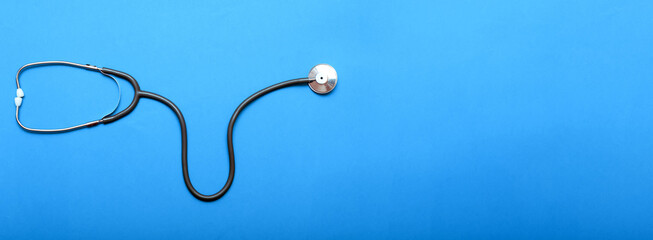 Stethoscop on a blue background. Top view. Copy Space. Plase for text. Banner