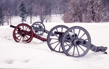 Fototapeta na wymiar Three Valley Forge cannons in the snow Royalty free stock image