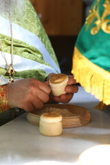 Orthodox priest during the liturgy, Procurion, prosphora. for Communion to the Throne of the Orthodox Church. The concept of the Orthodox faith.