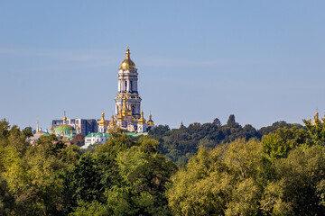 Fototapeta na wymiar View of the large bell tower and other churches in the Kyivo-Pecherska Lavra. Kyiv. Ukraine. Kyivo-Pechersky Monastery. Summer sunny day.