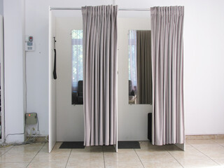 Two empty fitting rooms in the store