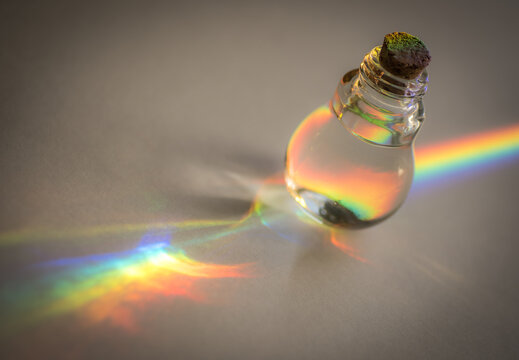 Light Refracting A Rainbow Through A Glass Bottle