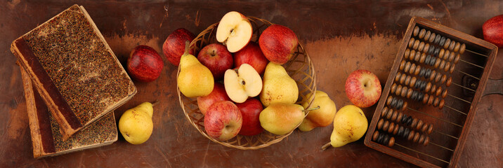 Panorama with apples, pears and wooden bills in retro style
