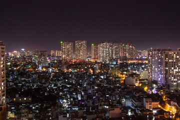 Fototapeta na wymiar Ho Chi Minh (Saigon) City night view from rooftop