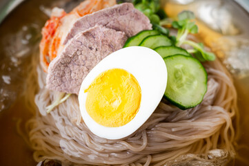 korean style cold noodle in silber bowl
