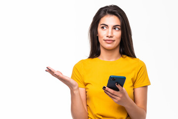 Young woman use phone isolated on gray background