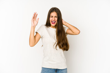 Obraz premium Young caucasian woman isolated on white background screaming with rage.