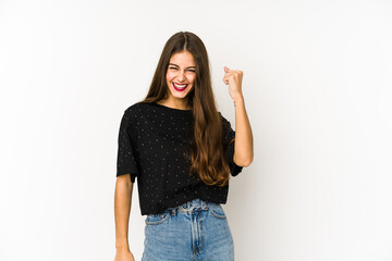 Young caucasian woman isolated on white background celebrating a victory, passion and enthusiasm, happy expression.