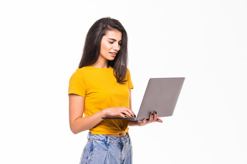 Young woman holding a laptop isolated on white background