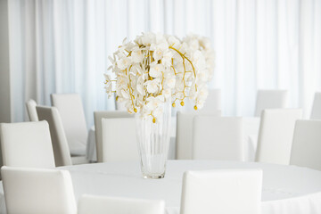 Empty restaurant luxury interior background. Empty chair and table inside room photo. White restaurant interior.