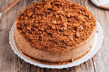 Honey cake on a wooden background