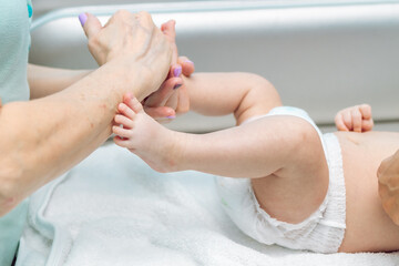 Baby massage closeup. Mother and child. Newborn.