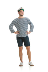 Posing confident. Caucasian male sailor in uniform on white studio background. Young man using modern devices and gadgets in his work. Concept of tech, professional occupation, job of seaman.