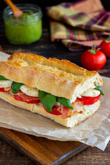 Caprese sandwich with tomatoes, mozzarella, basil and bacon. Healthy eating. Italian cuisine.