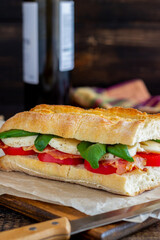 Caprese sandwich with tomatoes, mozzarella, basil and bacon. Healthy eating. Italian cuisine.