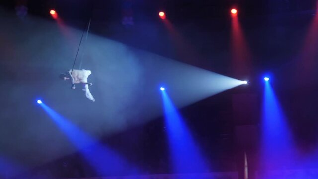 Aerialist on canvases in circus