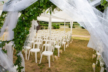 chairs decor on lawn ready for secular wedding ceremony