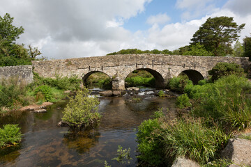 Fototapeta na wymiar Postbridge Clapper Bridge in Dartmoor, Devon, UK