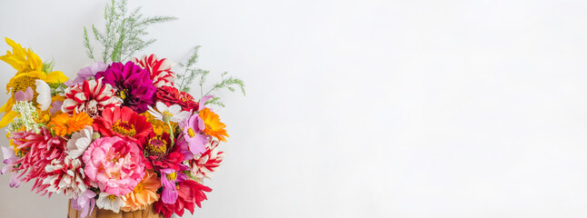 Background banner with colorful beautiful floral bouquet with copy space on a white background.