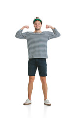 Strong posing. Caucasian male sailor in uniform on white studio background. Young man using modern devices and gadgets in his work. Concept of tech, professional occupation, job of seaman.