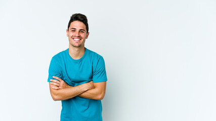 Young caucasian man isolated on white background laughing and having fun.