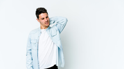 Young caucasian man isolated on white background suffering neck pain due to sedentary lifestyle.