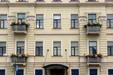 building facade with balconies and flowers