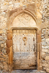 A 2020 view of an old door, Lagrasse, South of France.